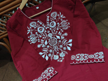The lightweight kurta features intricate thread embroidery along the neckline, sleeves,