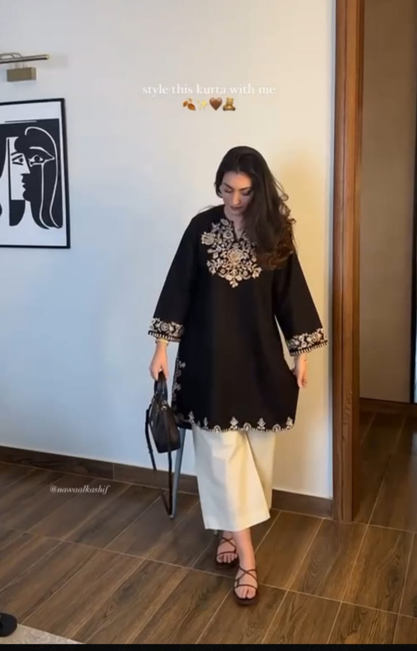 The lightweight kurta features intricate thread embroidery along the neckline, sleeves,
