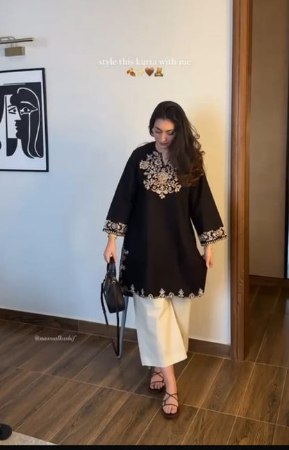 The lightweight kurta features intricate thread embroidery along the neckline, sleeves,