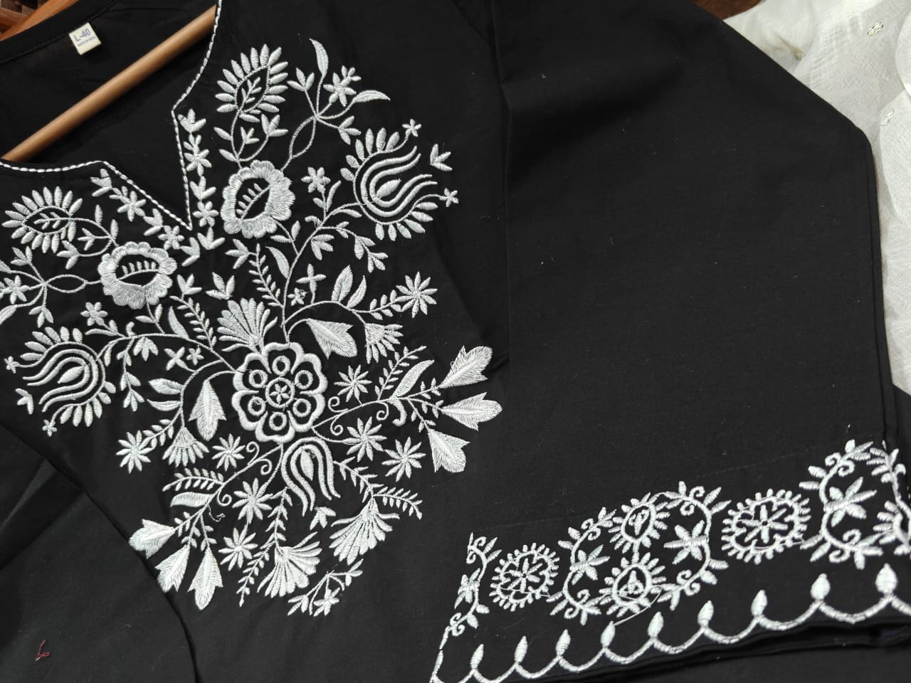 The lightweight kurta features intricate thread embroidery along the neckline, sleeves,