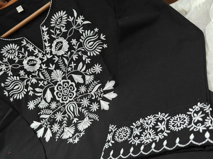 The lightweight kurta features intricate thread embroidery along the neckline, sleeves,