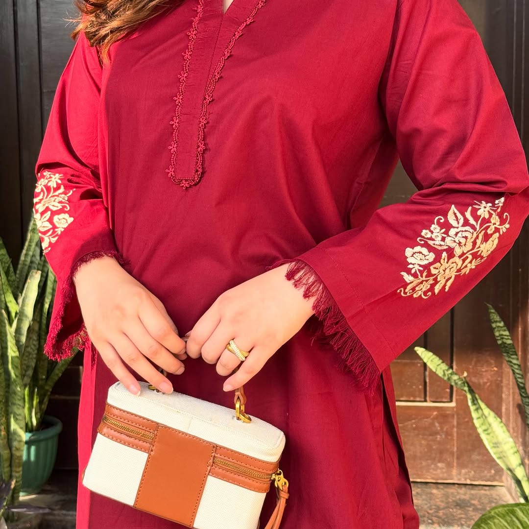 two piece  embroidery and details on the sleeves, paired with straight Pants