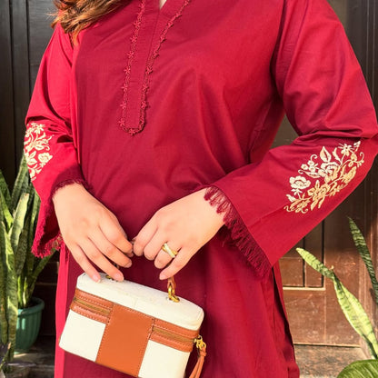 two piece  embroidery and details on the sleeves, paired with straight Pants