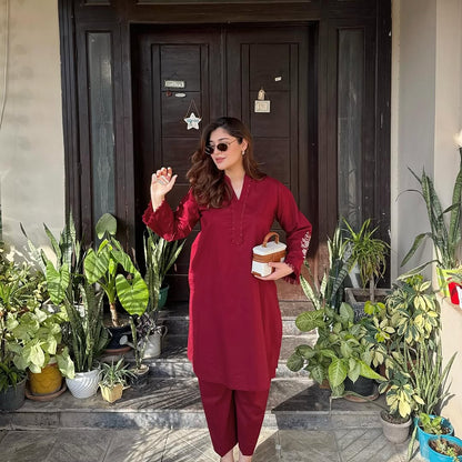 two piece  embroidery and details on the sleeves, paired with straight Pants