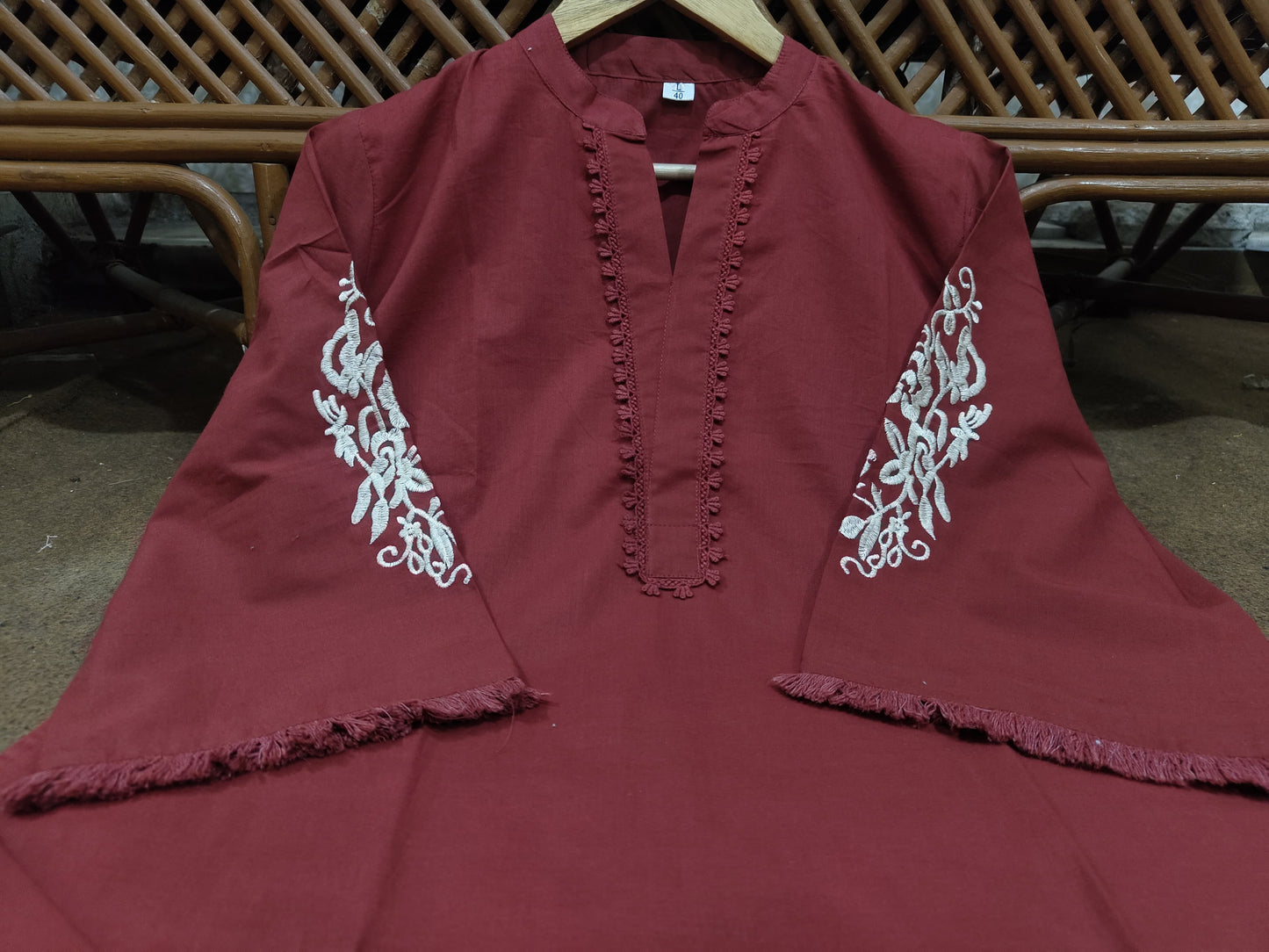 two piece  embroidery and details on the sleeves, paired with straight Pants