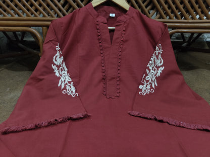 two piece  embroidery and details on the sleeves, paired with straight Pants