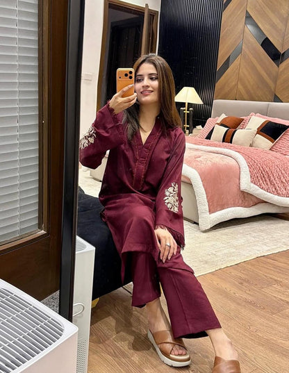 two piece  embroidery and details on the sleeves, paired with straight Pants